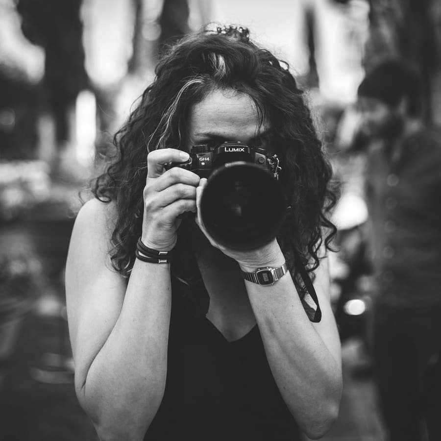 A photographer holding a camera