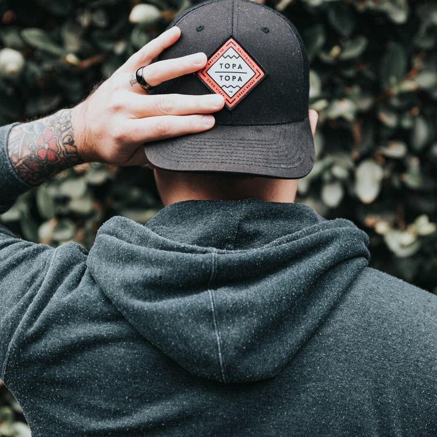 A cap and a hood, pulled low