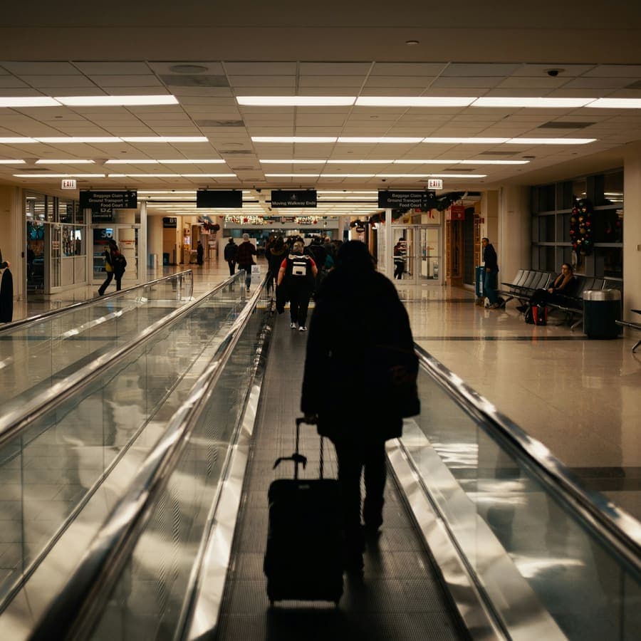 A man walking with luggage
