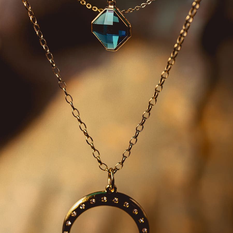 Two gold charm necklaces