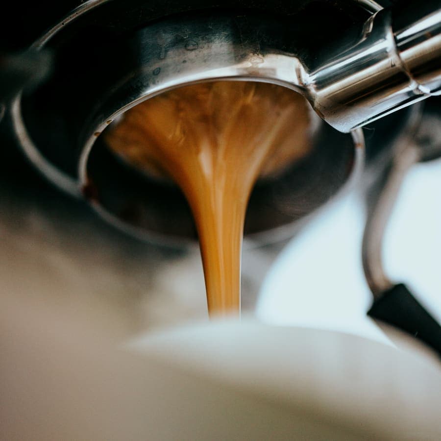 Espresso pouring into a cup