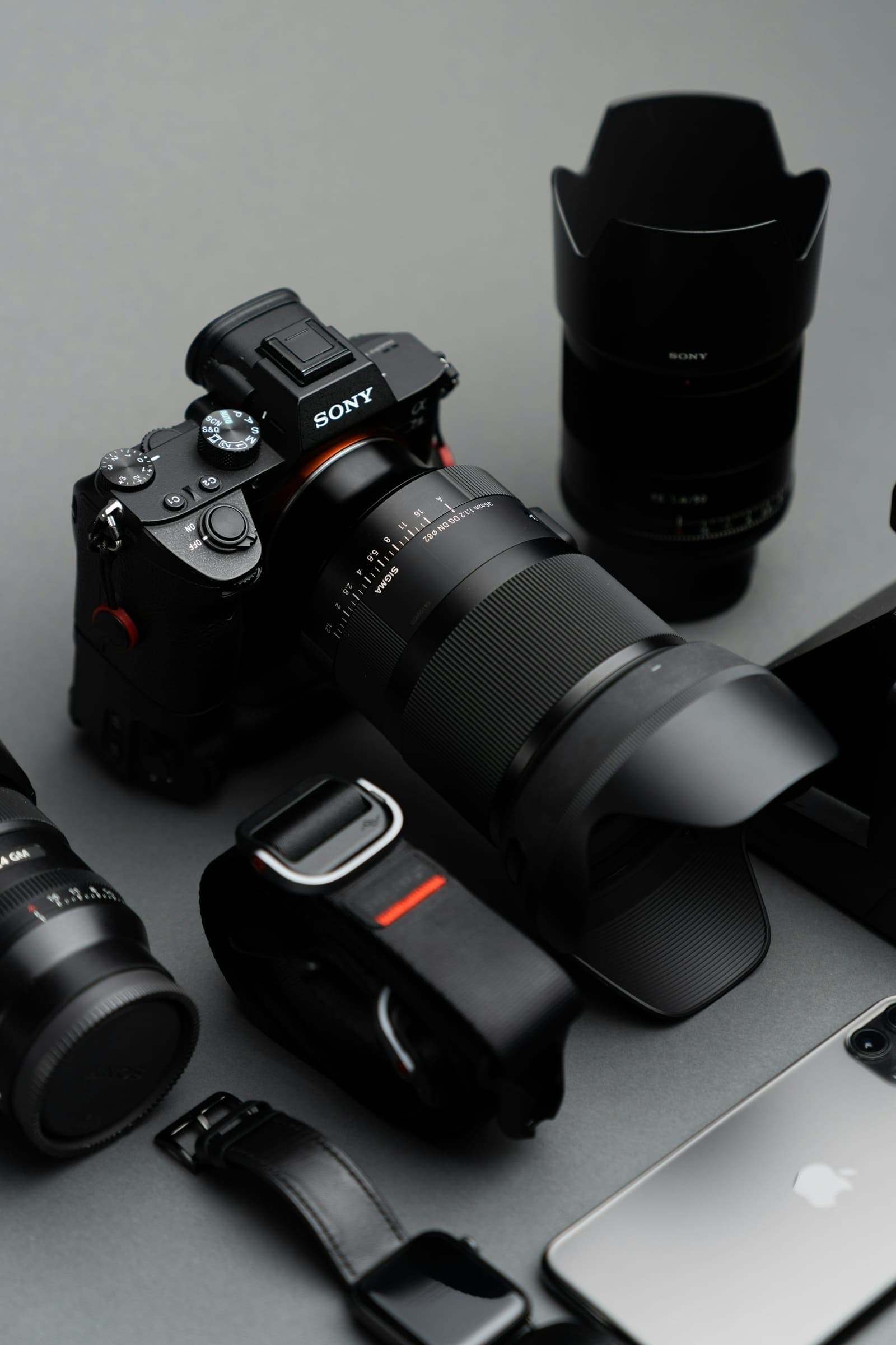 Six black zoom lenses in a row