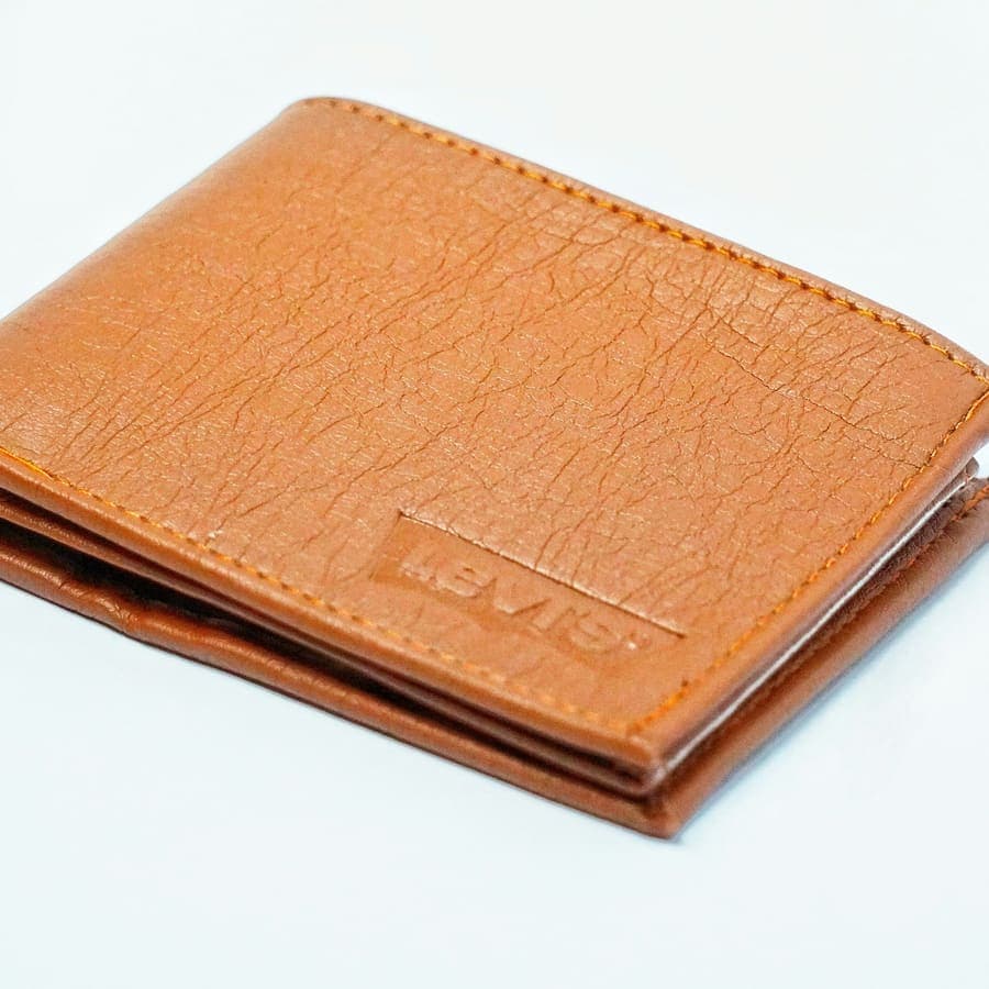A leather wallet on a white table