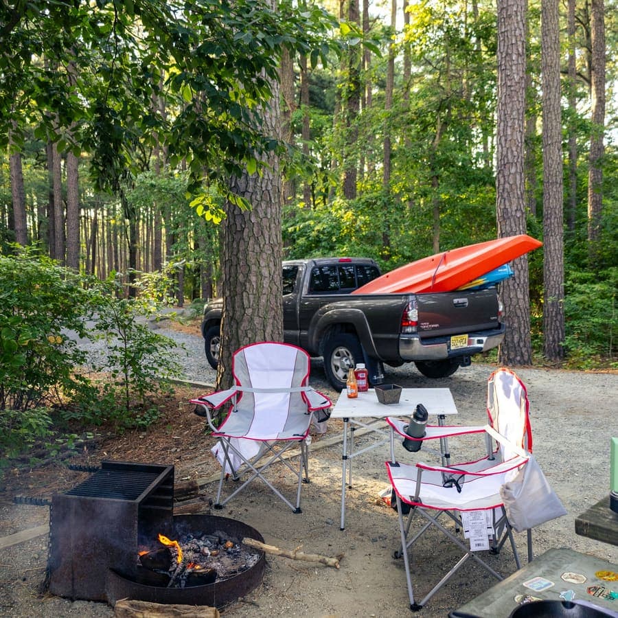 An awning open over camp at dusk