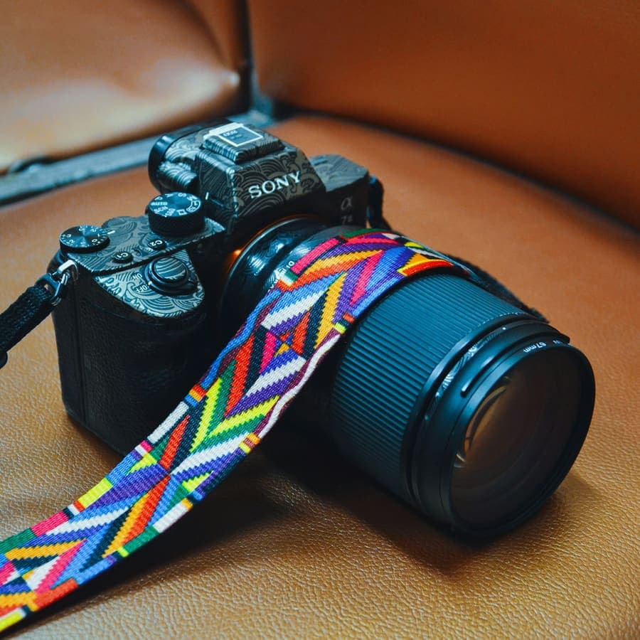 A camera with a woven strap