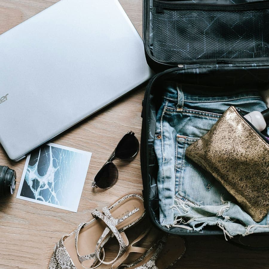 A camera, sunglasses and a bag
