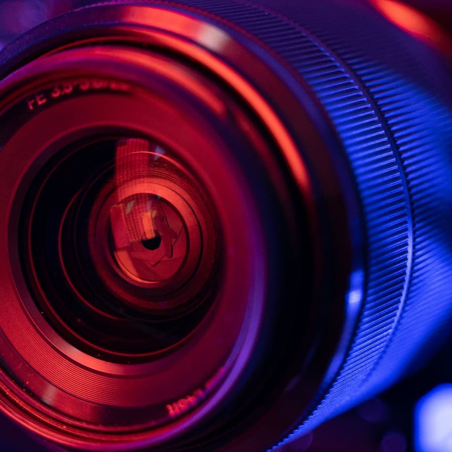 A camera lens on a white table