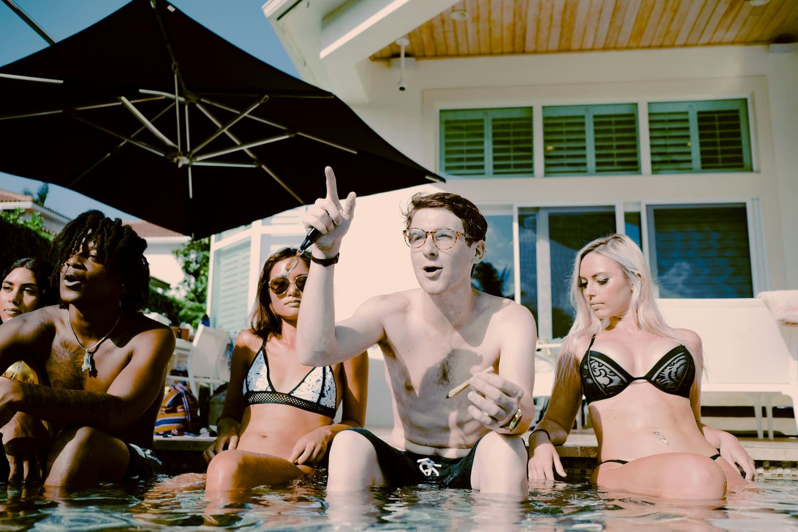 Three friends sitting in the pool
