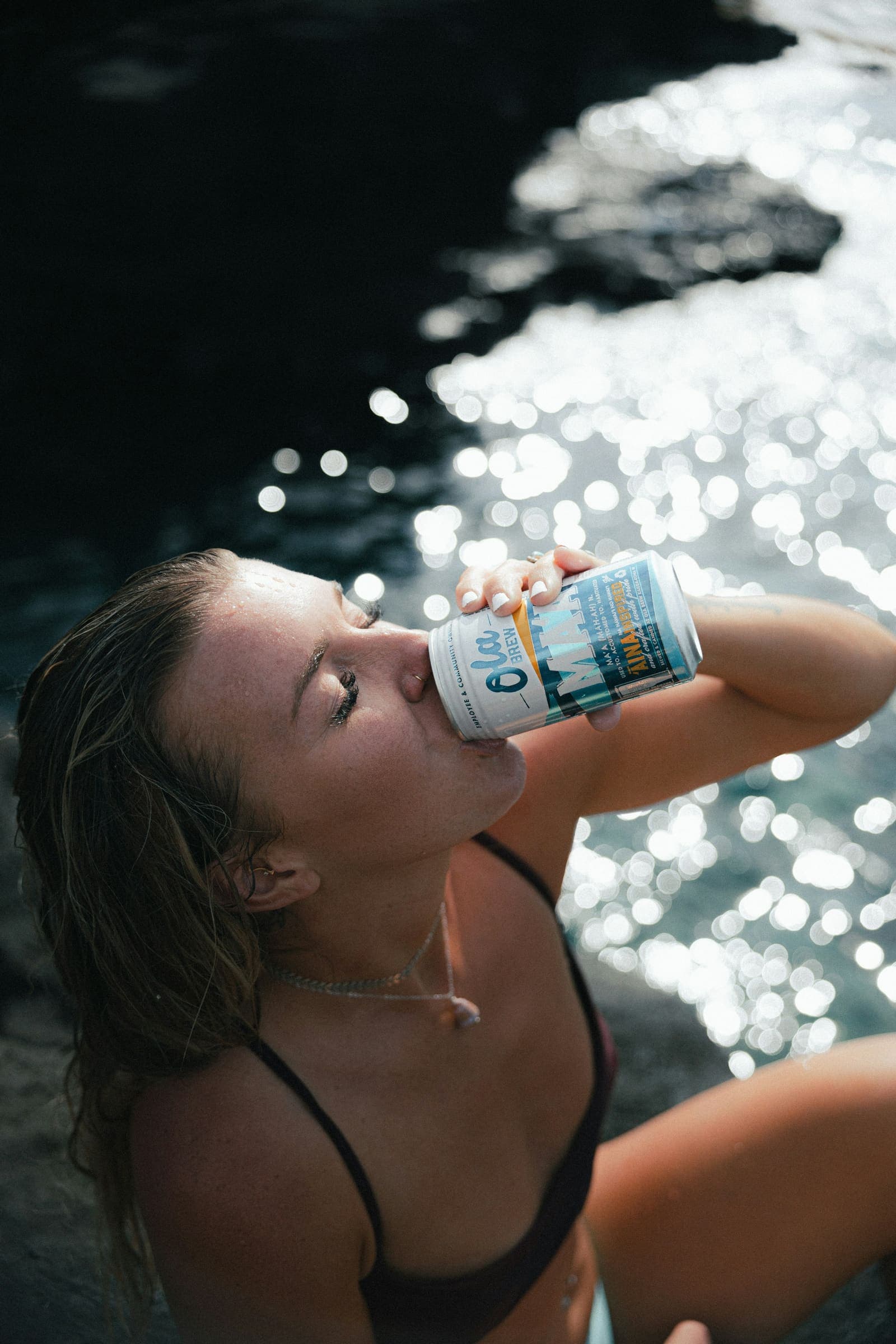 Drinking from a can in the sun